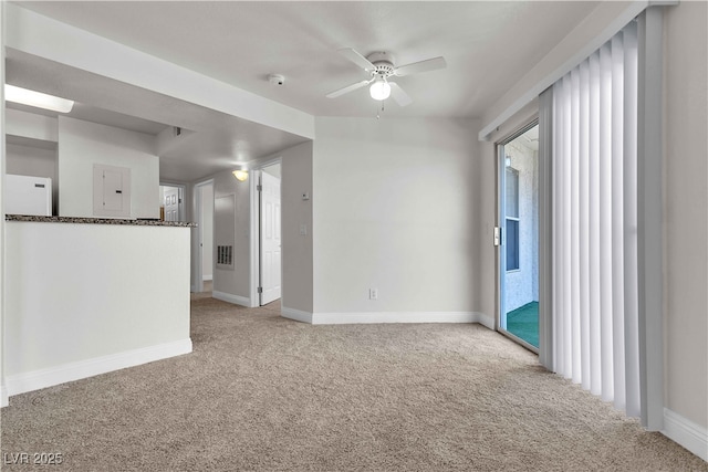 carpeted empty room with electric panel and ceiling fan