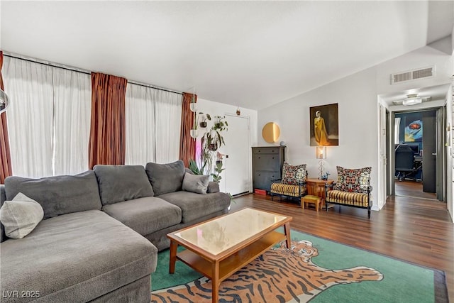 living room with hardwood / wood-style flooring and lofted ceiling