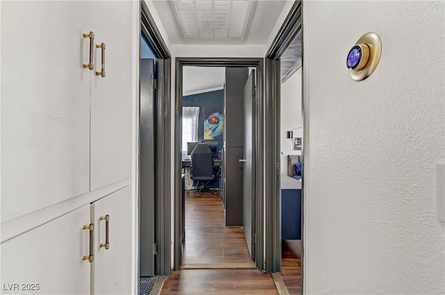 hallway featuring dark hardwood / wood-style floors