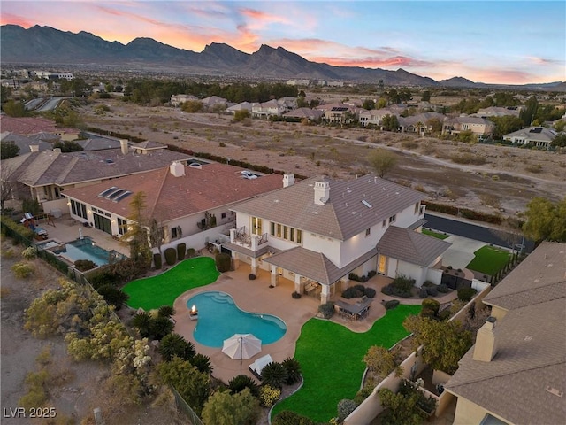 aerial view at dusk with a mountain view