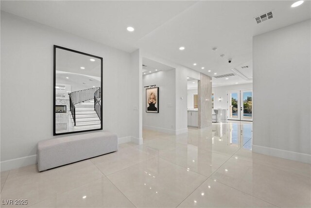 hall featuring light tile patterned floors