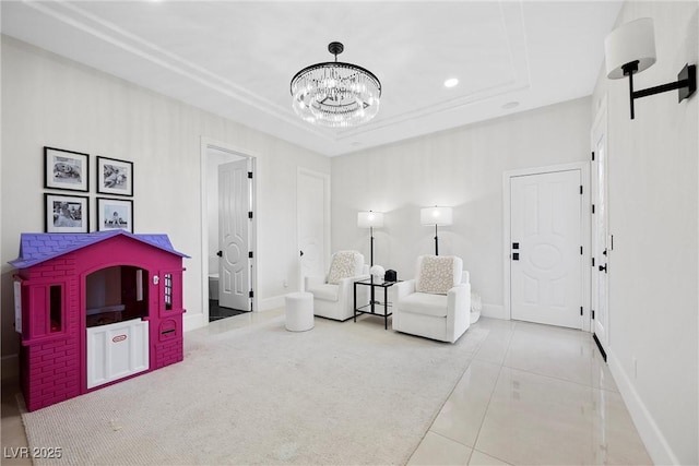 living area featuring a raised ceiling, light tile patterned floors, and an inviting chandelier