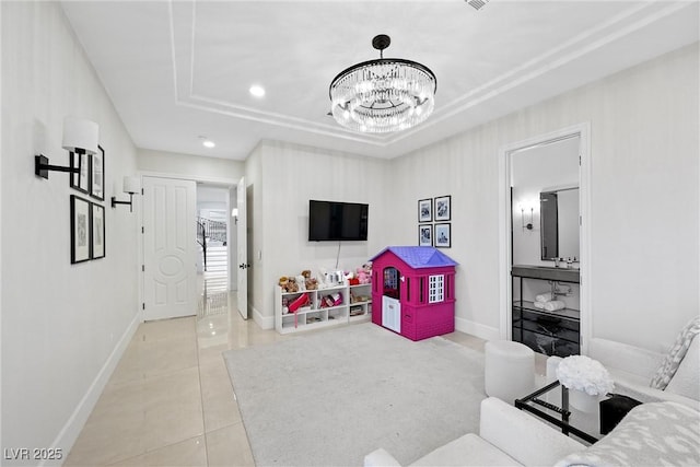 living room featuring a raised ceiling, light tile patterned flooring, and an inviting chandelier