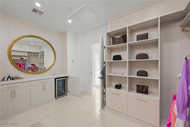 bathroom with vanity, tile patterned floors, and beverage cooler