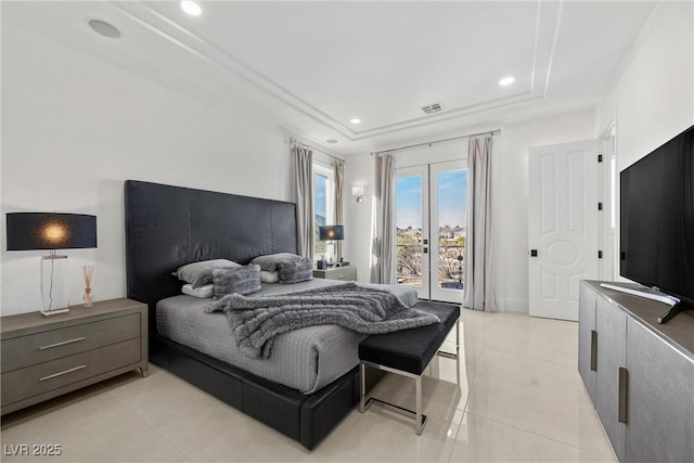 tiled bedroom featuring access to outside and a tray ceiling