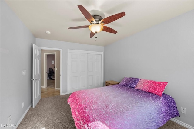 bedroom with ceiling fan, a closet, and carpet floors