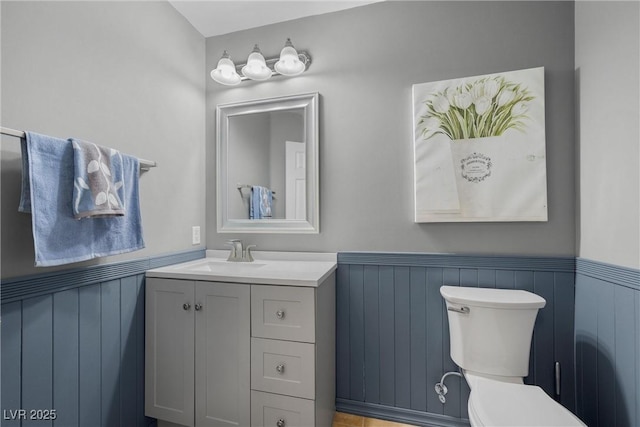 bathroom with toilet and vanity