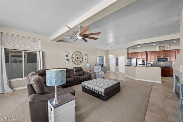 living room with ceiling fan and light tile patterned floors