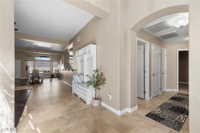 hall featuring light tile patterned floors