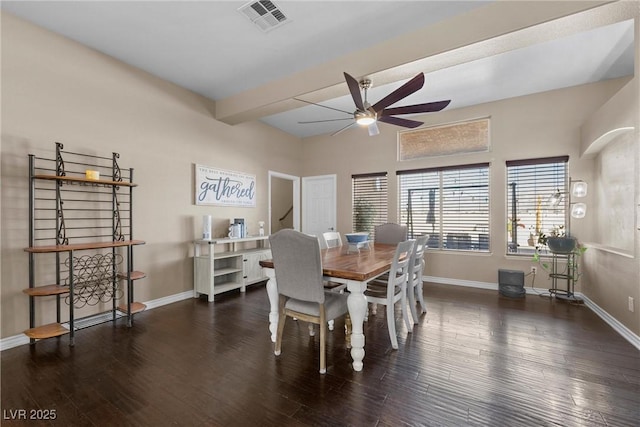 dining room with ceiling fan, beam ceiling, and dark hardwood / wood-style floors