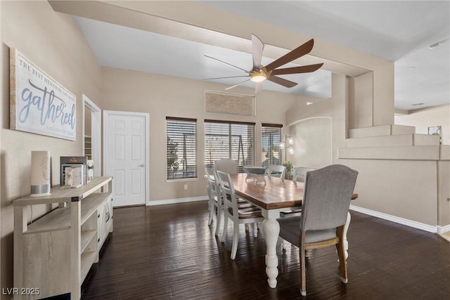 dining space featuring ceiling fan and dark wood-type flooring