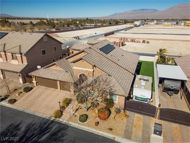 birds eye view of property featuring a mountain view