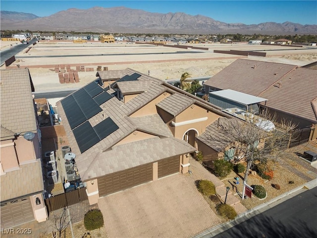 birds eye view of property featuring a mountain view