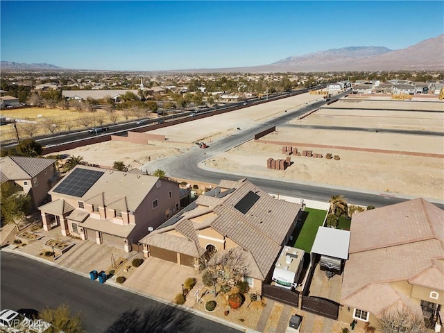 birds eye view of property featuring a mountain view