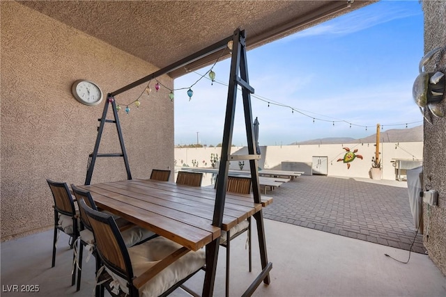 view of patio featuring a water view