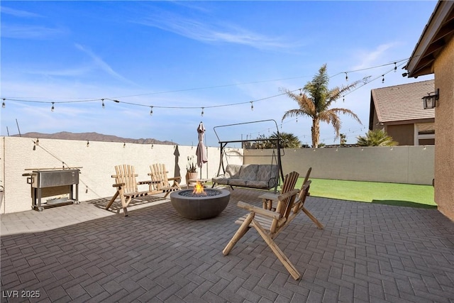 view of patio featuring an outdoor fire pit