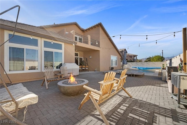 view of patio / terrace featuring an outdoor fire pit