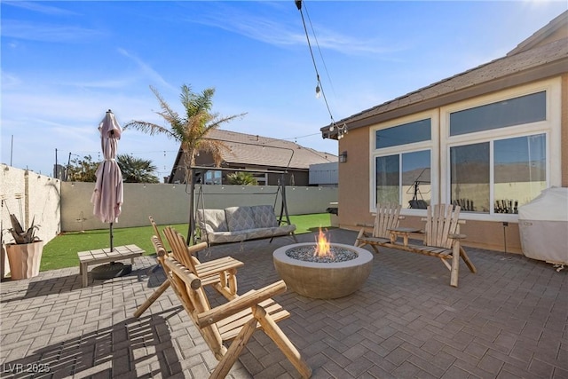 view of patio featuring grilling area and an outdoor fire pit