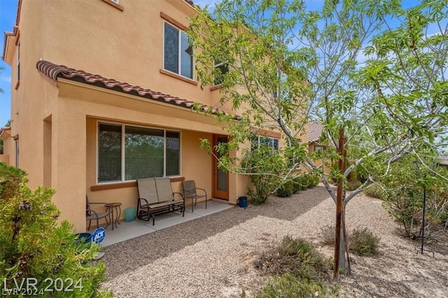 back of house with a patio area