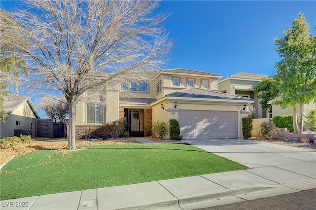 view of front of property featuring a front lawn and a garage