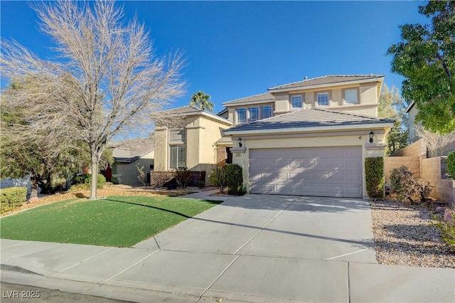 view of front of property with a front yard and a garage