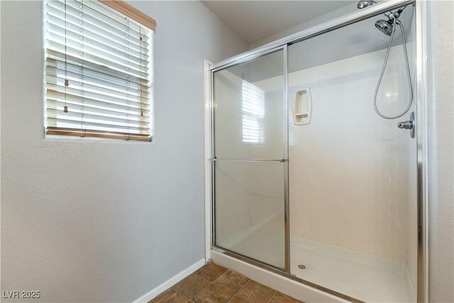 bathroom featuring tile patterned floors and an enclosed shower