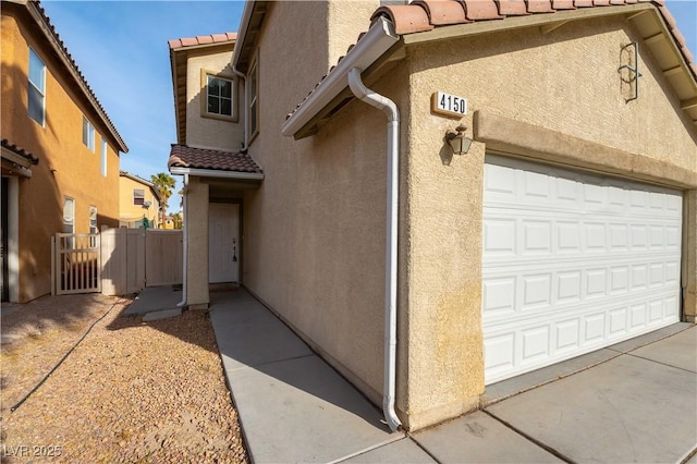 view of exterior entry featuring a garage