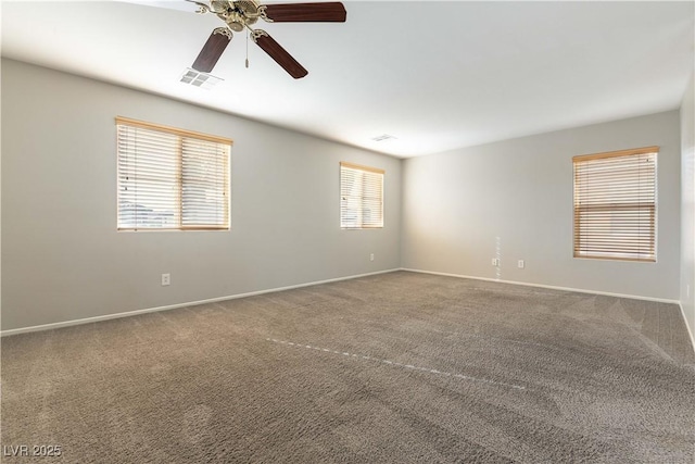 carpeted empty room featuring ceiling fan