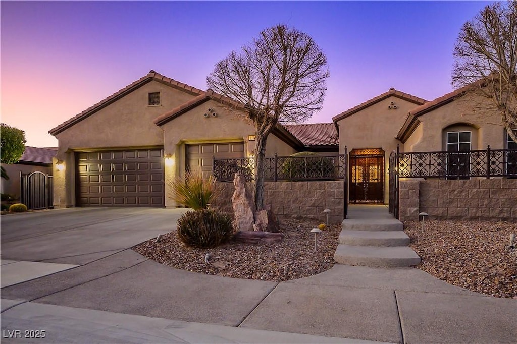 mediterranean / spanish-style home featuring a garage