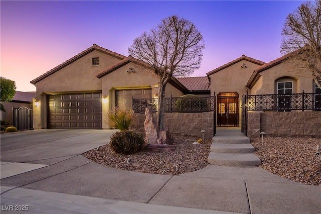 mediterranean / spanish-style home featuring a garage