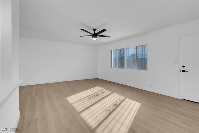 unfurnished room featuring light hardwood / wood-style flooring and ceiling fan