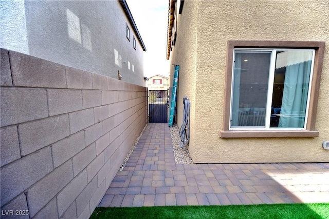 view of side of home featuring a patio area