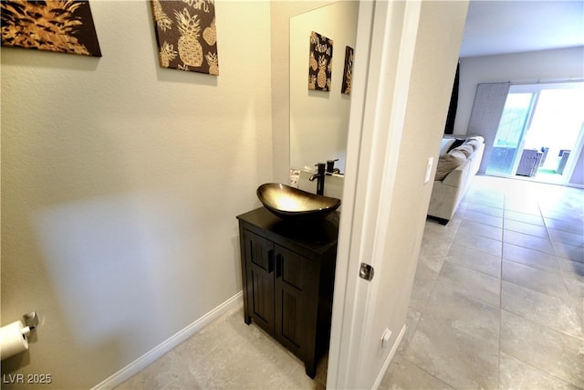 bathroom featuring tile patterned flooring and vanity