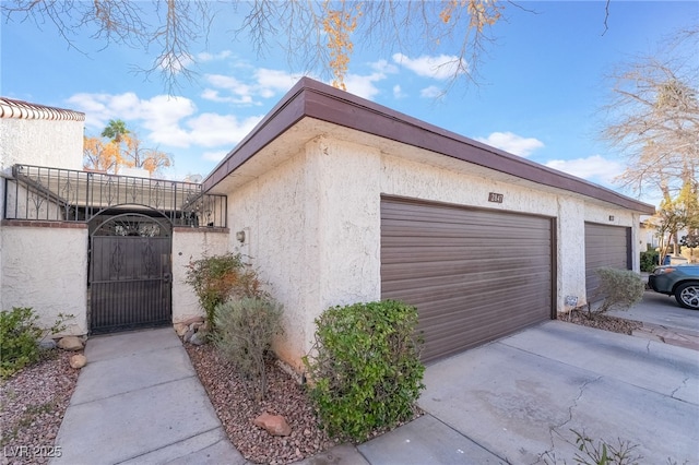 view of side of home with a garage