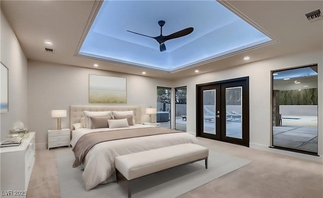 carpeted bedroom featuring french doors, ceiling fan, access to exterior, and a raised ceiling