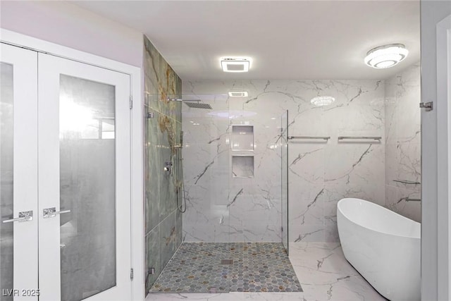 bathroom featuring plus walk in shower and french doors