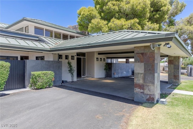 exterior space with a carport