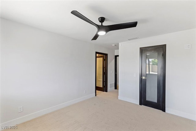 unfurnished bedroom with light colored carpet and ceiling fan