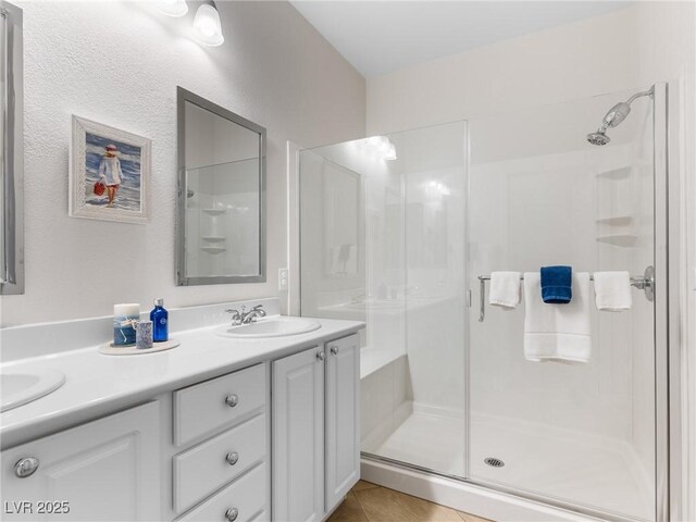 bathroom featuring vanity, tile patterned floors, and an enclosed shower