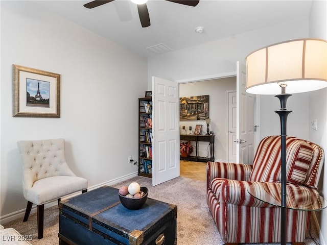 sitting room with light carpet and ceiling fan