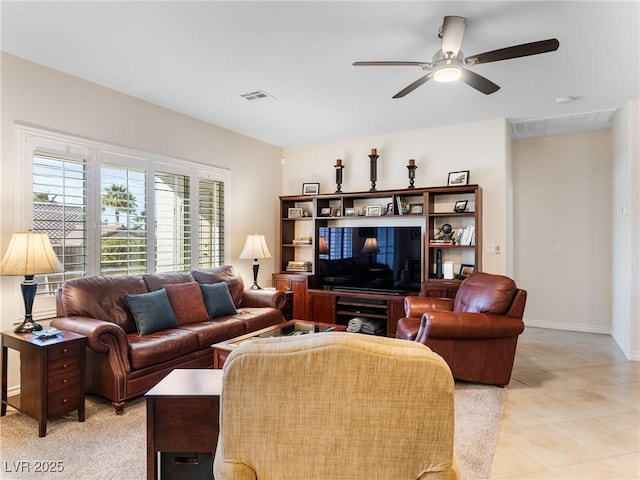 tiled living room featuring ceiling fan