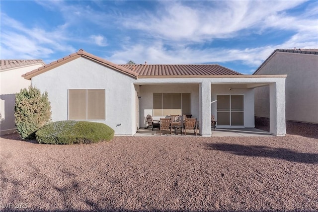 rear view of house featuring a patio area