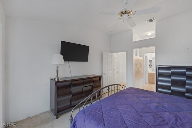 carpeted bedroom featuring ceiling fan, lofted ceiling, and connected bathroom