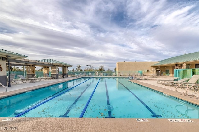 view of swimming pool with a patio area