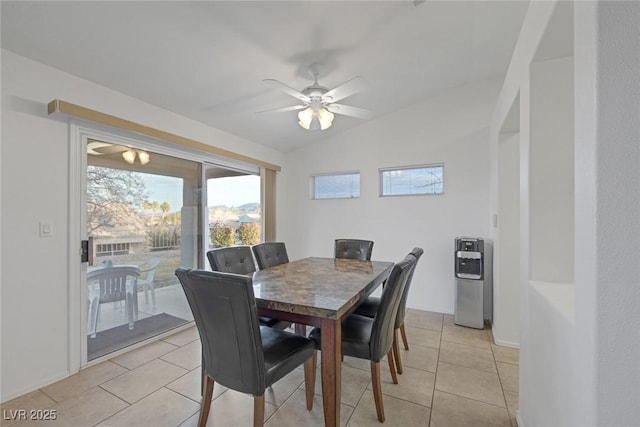 dining area featuring light tile patterned floors, ceiling fan, and lofted ceiling