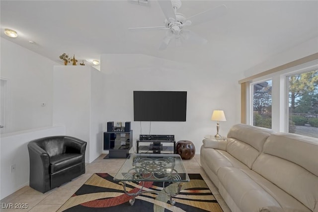 tiled living room featuring ceiling fan and lofted ceiling