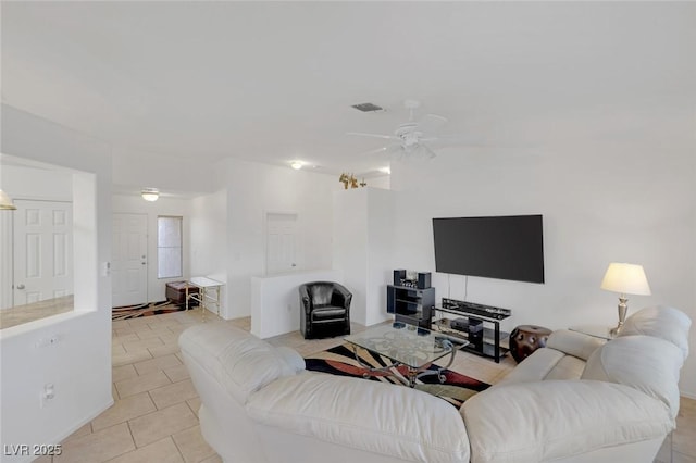 living room featuring light tile patterned floors and ceiling fan