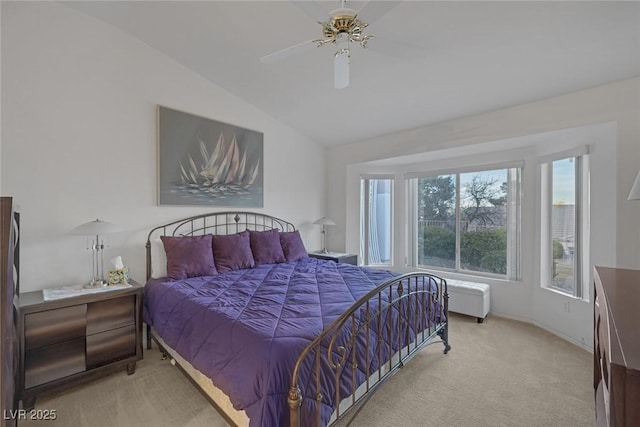 carpeted bedroom featuring ceiling fan and lofted ceiling