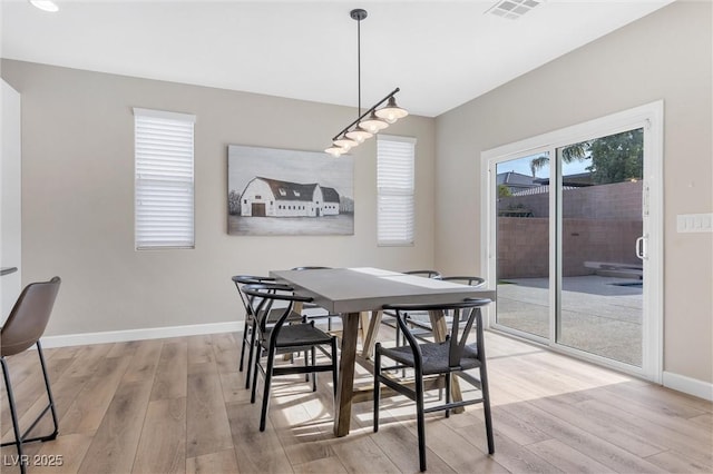 dining area with light wood-type flooring