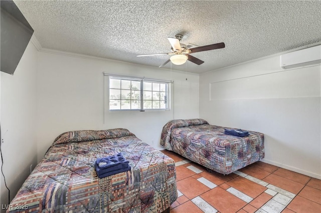 bedroom featuring a wall unit AC, ceiling fan, light tile patterned floors, and a textured ceiling